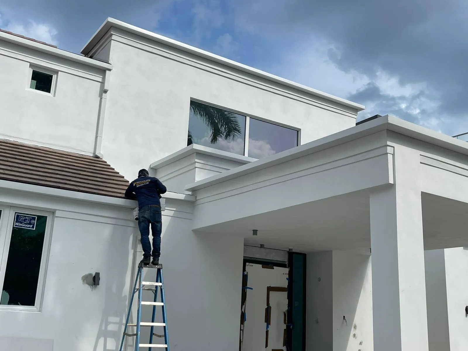 Master Pro Rain Gutters crew installing a gutter system
